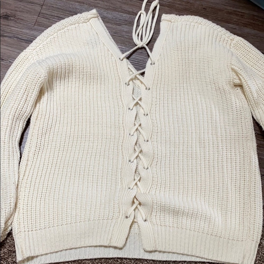 Back tie sweater.